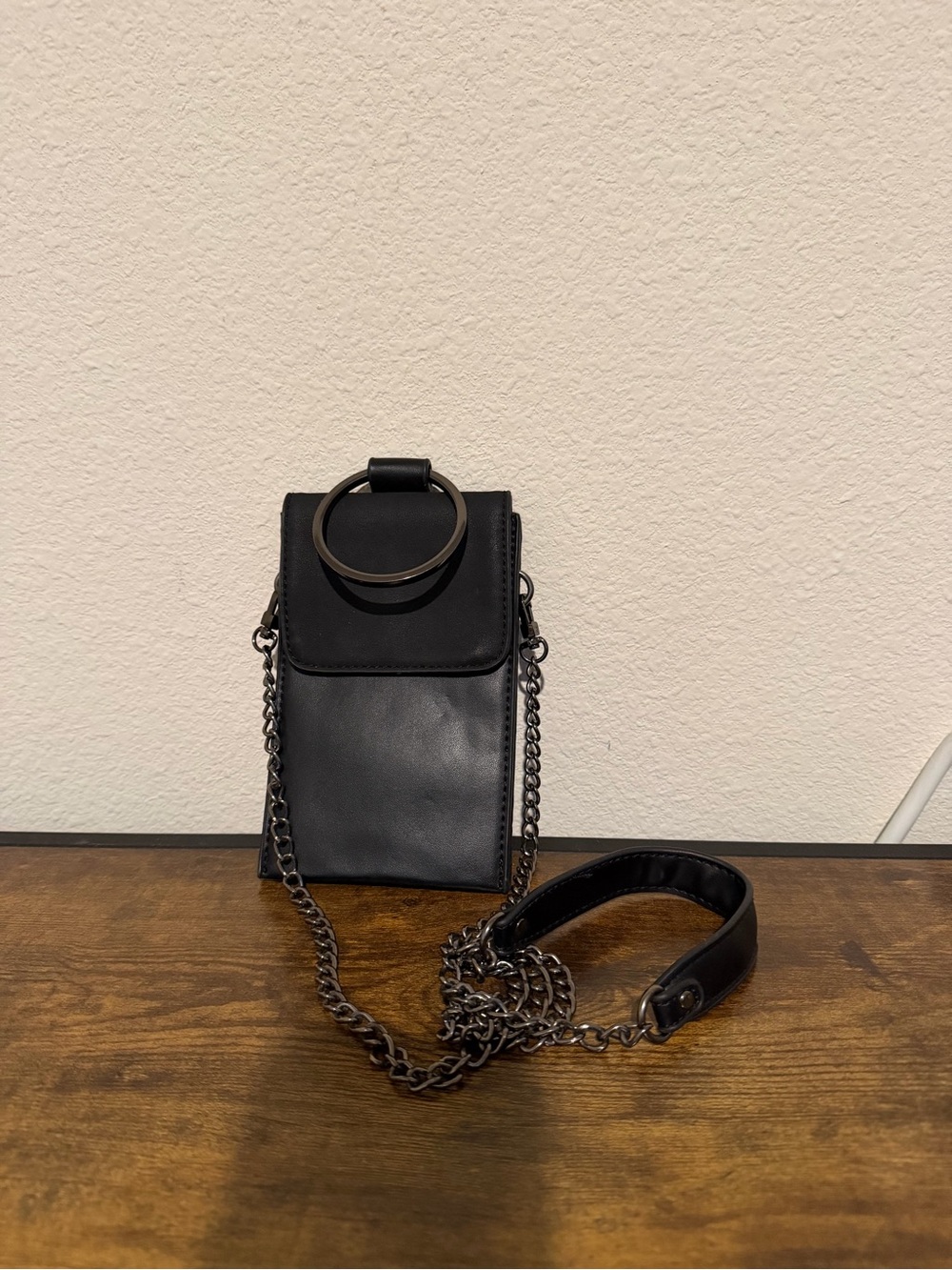 Minimalist Black Leather Crossbody with Ring Accent
